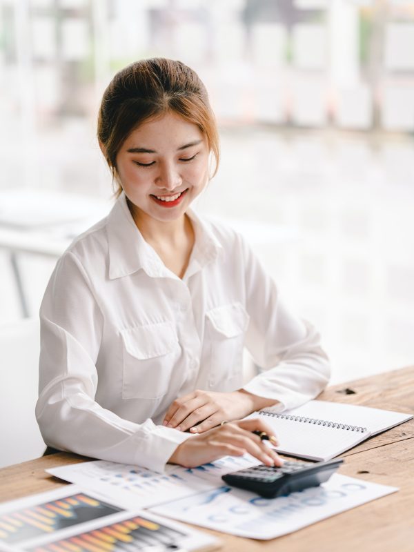 portrait-of-an-asian-woman-working-on-a-tablet-computer-in-a-modern-office-make-an-account-analysis.jpg